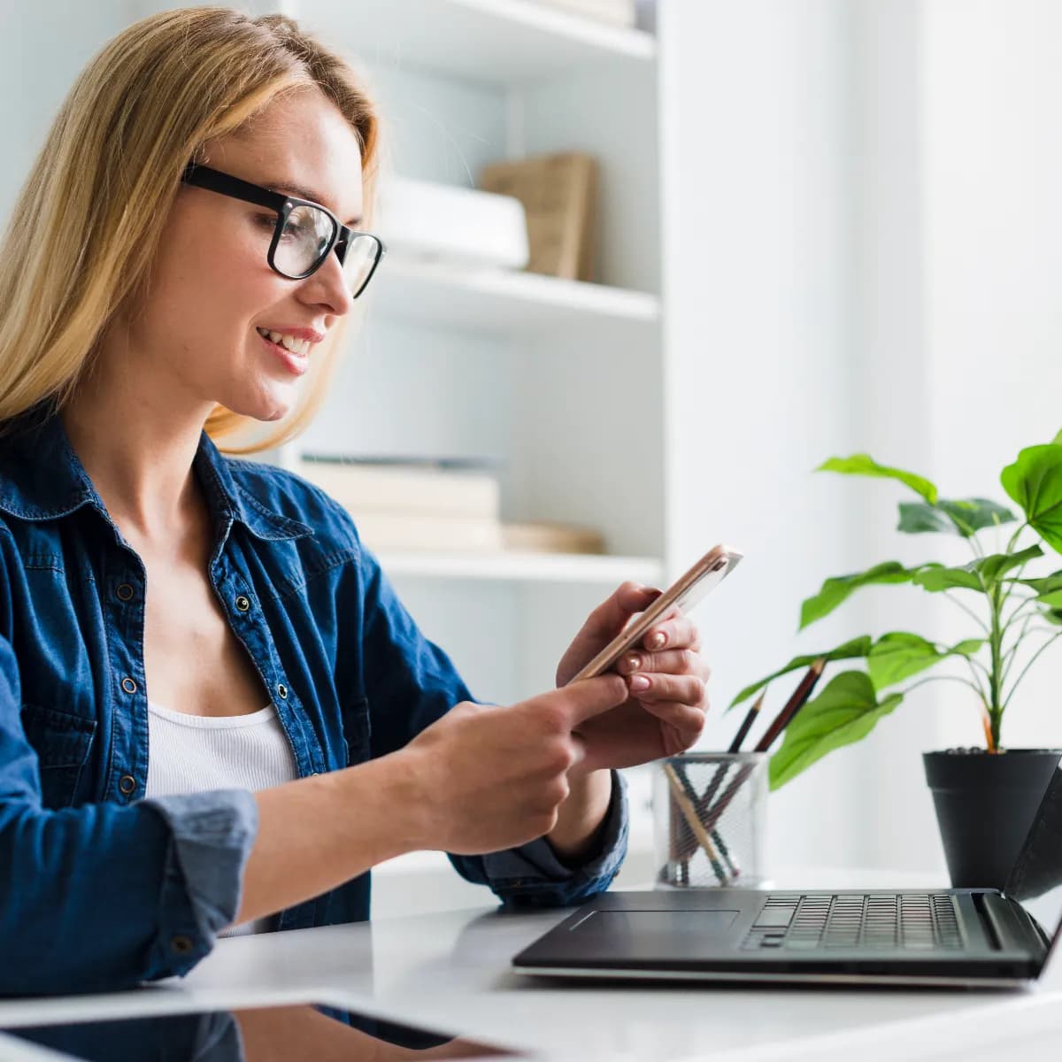 blond-woman-working-interacting-with-smartphone