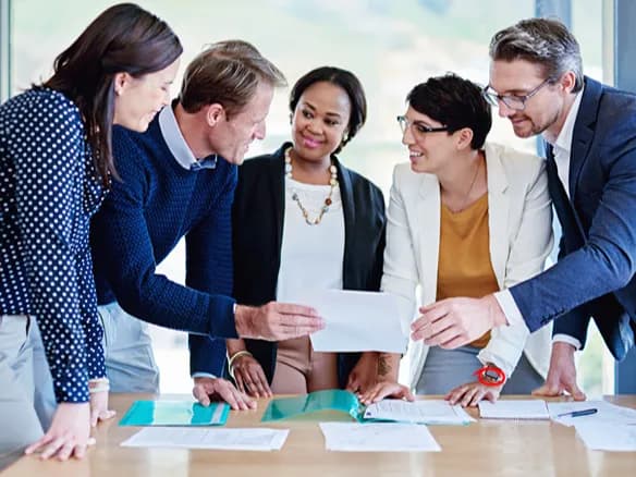 collaborative-team-discussing-project-around-table